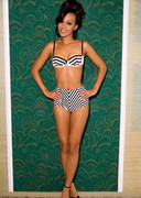 Ebony babe strips out of a bikini