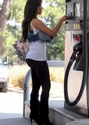 Kim Kardashian sexy in tight pants while pumping gas