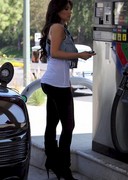 Kim Kardashian sexy in tight pants while pumping gas