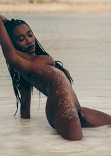 Black girl nude at the beach