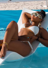 Ashanti lavishes at the beach while showing off her perfect booty