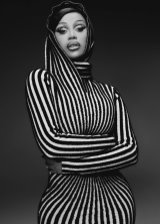 Cardi B poses sensually highlighting her big ass