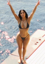 Kim Kardashian and Olivia Pierson go off swimming wearing bikinis and showing off their hot ass