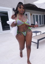 Thick ebony babe with a huge booty goes poolside and gets fondled hard